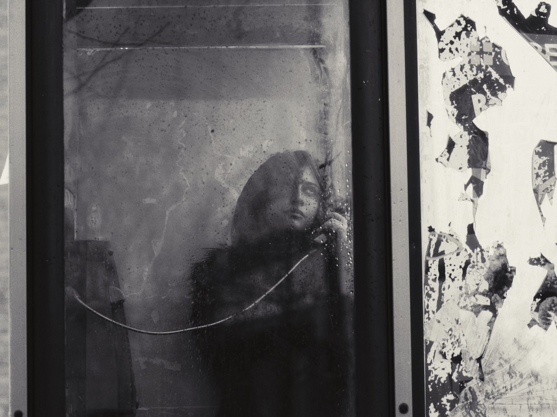 Marcelo Seguí Gill — still from the music video Neustalgia by Neusha, a black and white photo of a figure in a phone booth